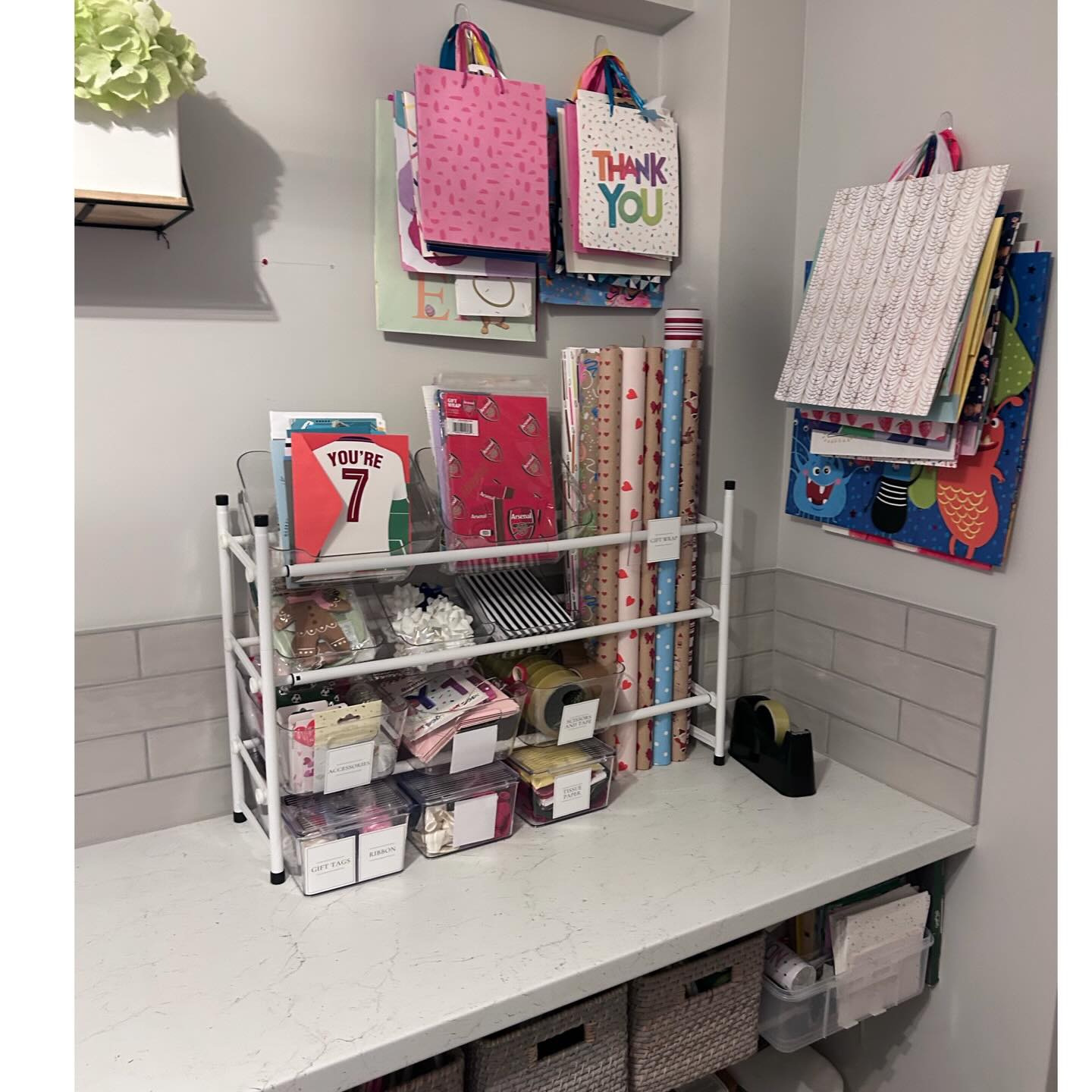 Organised gift wrapping station with smart storage and labelled supplies