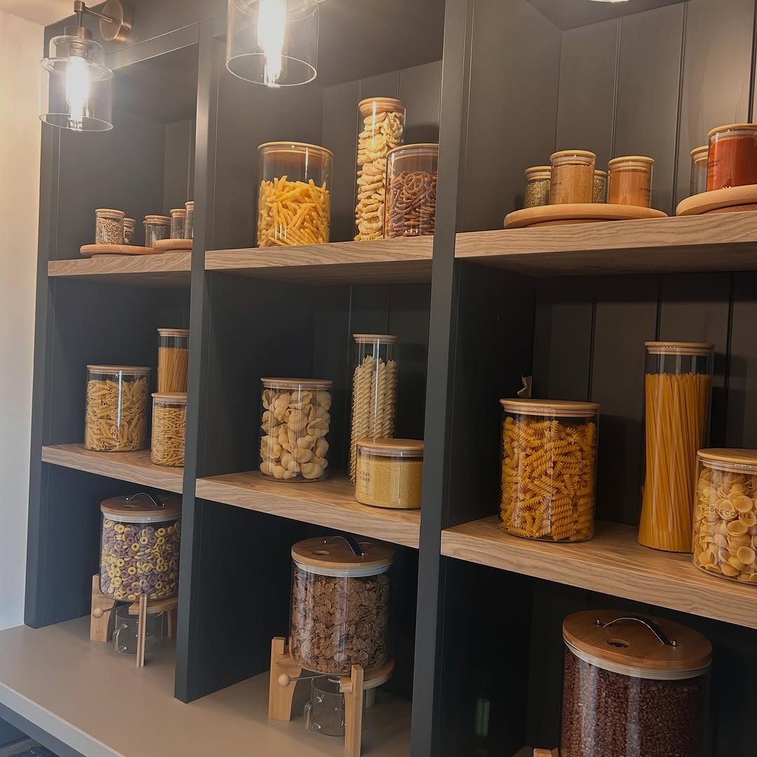Thoughtfully organised pantry shelving in a barn conversion